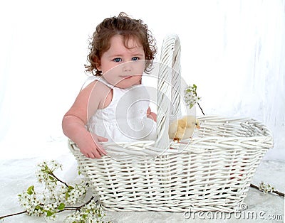 Baby and Chick in Wicker Basket Stock Photo