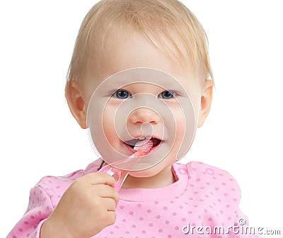 Baby cleaning teeth and smiling, isolated on white Stock Photo