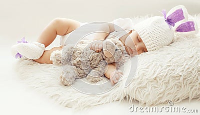 Baby comfort! Sweet infant at home sleeping with teddy bear Stock Photo