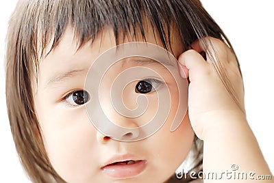 Baby with confused face Stock Photo