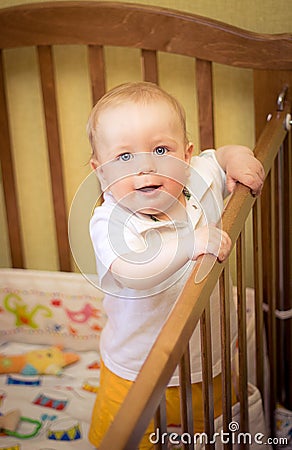 Baby in cot Stock Photo
