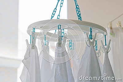 Baby cotton diapers hanging on plastic white cloth clamp for sun Stock Photo