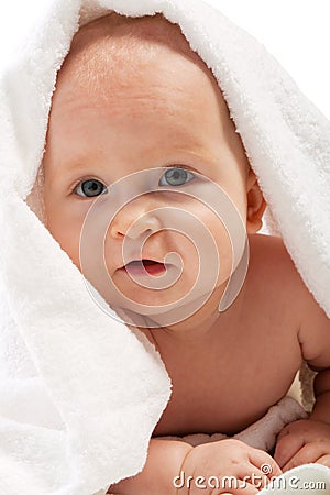 Baby covered with towel Stock Photo