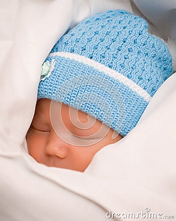 Baby in coverlet Stock Photo