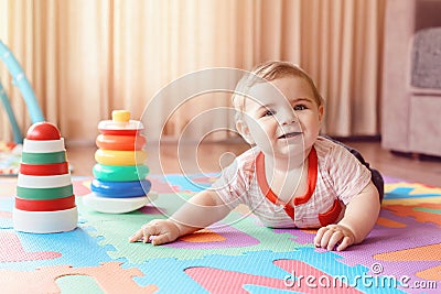 Baby crawling on playmat. Early education development Stock Photo