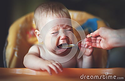 Baby cry, capricious, refuse to eat Stock Photo