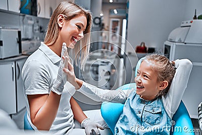 Baby cute girl gives five dentist Stock Photo