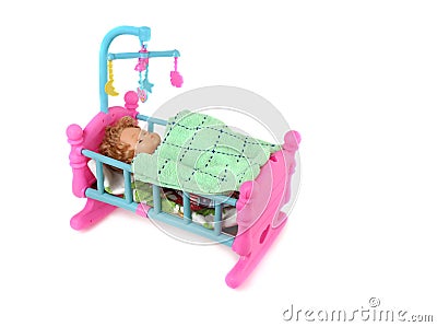 Baby Doll in Bed Stock Photo