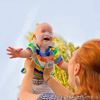 Baby with Down syndrome is happy Stock Photo