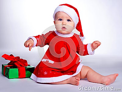 Baby dressed as Santa Stock Photo