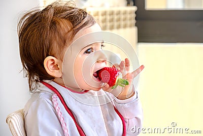 Baby eat strawberry newborn eat fruit Stock Photo