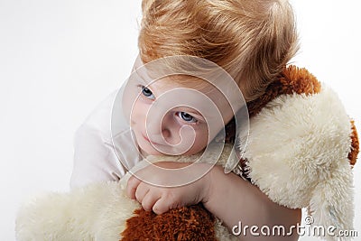 Baby embrace toy dog Stock Photo