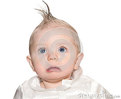 Baby with fake mohawk and a frown Stock Photo