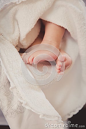 Baby feet in in a blanket. Christening. Stock Photo