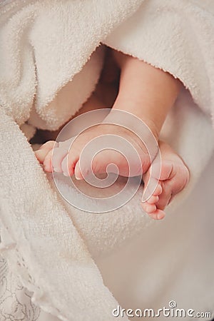 Baby feet in in a blanket. Christening. Stock Photo