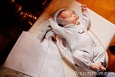 A baby fell asleep on a dressing table in a Church. the ordinance of baptism. Stock Photo