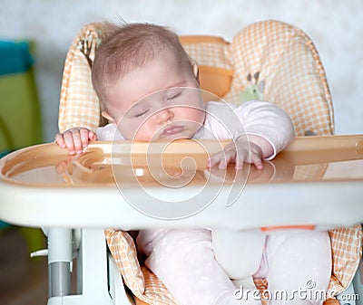 Baby fell asleep after eating Stock Photo