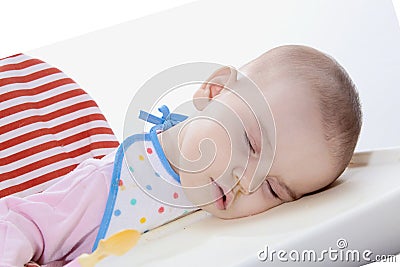 Baby fell asleep while feeding on a white background isolate Stock Photo