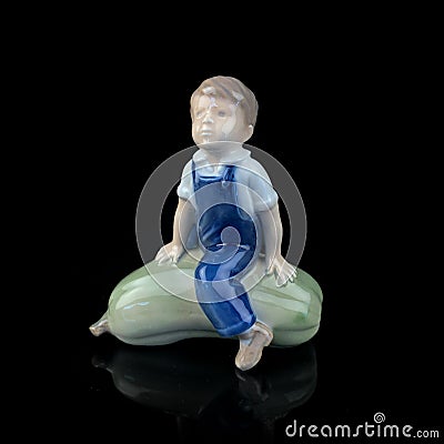 Baby figurine on a black background. Baby figurine on a black background. Stock Photo