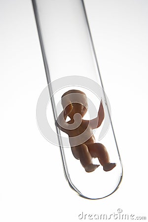 Baby Figurine In A Test Tube Stock Photo