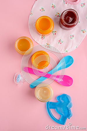 Baby food, spoons, pacifier, teether Stock Photo