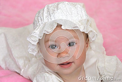 Baby girl in christening dress Stock Photo