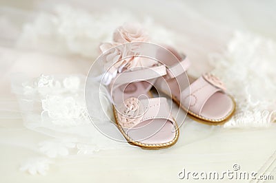 Baby girl christening shoes and headband Stock Photo