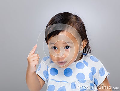 Baby girl frighten with finger Stock Photo