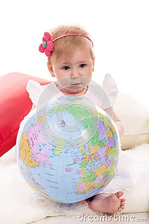 Baby girl holding world ball Stock Photo