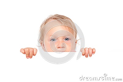 Baby girl looking over white board. Stock Photo