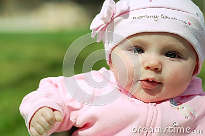 Baby Girl in Mommy Loves Me Hat Stock Photo