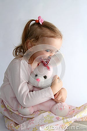 Baby girl and pink bunny Stock Photo
