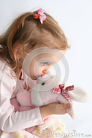 Baby girl and pink bunny Stock Photo