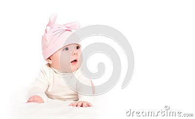 Baby girl in a pink hat with rabbit ears isolated on white Stock Photo