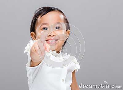 Baby girl point to front Stock Photo