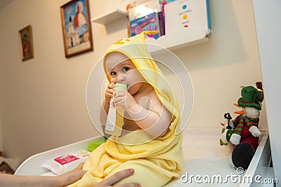 Baby girl pointing his finger straight to the camera. Cute adorable baby after bath time Stock Photo