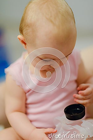 Baby girl pointing his finger straight to the camera. Cute adorable baby after bath time Stock Photo