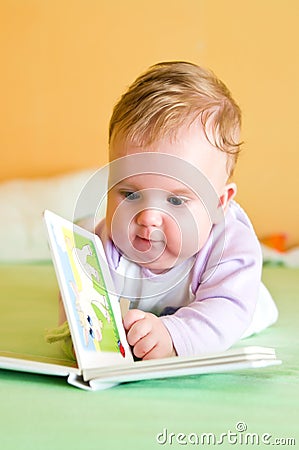 Baby girl reading Stock Photo