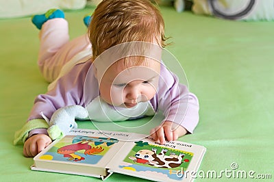 Baby girl reading book Stock Photo