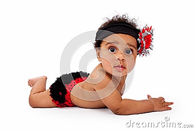 Baby Girl With Red and Black Bloomers and Headband Stock Photo