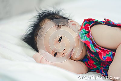 Baby Girl sleep with Aunty Stock Photo