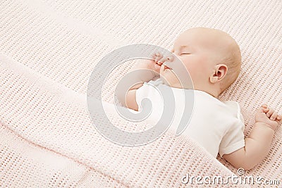 Baby Girl Sleep in Bed, Sleeping New Born Child on Pink Blanket Stock Photo