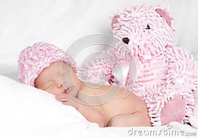 Baby girl with teddy bear Stock Photo