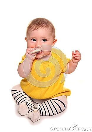 Baby girl trying a rice cake Stock Photo