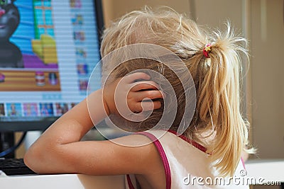 Baby girl watching cartoons Stock Photo