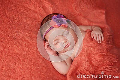 Baby Girl Wearing a Flower Headband Stock Photo