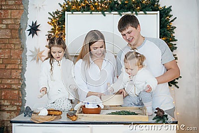 Baby girl in white and mother near Christmas Stock Photo