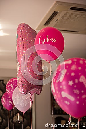 Baby girl 1 year old party rooms with balloons. Birthday party. Childhood Stock Photo