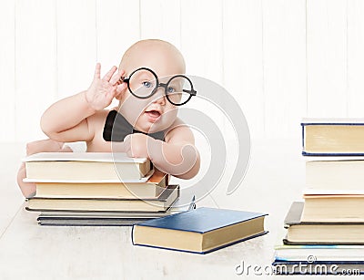 Baby in Glasses and Books, Kids Early Childhood Education Stock Photo