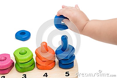 Baby Hand Playing Toy Stock Photo